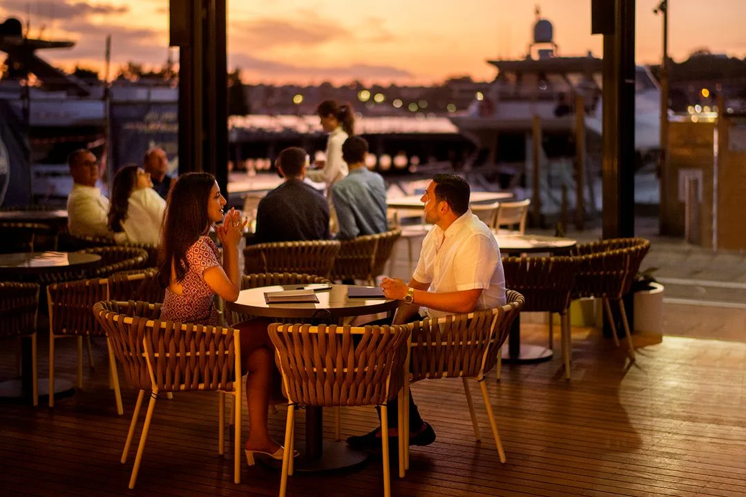 Guests dining by the water at Sala on Jones Bay Wharf
